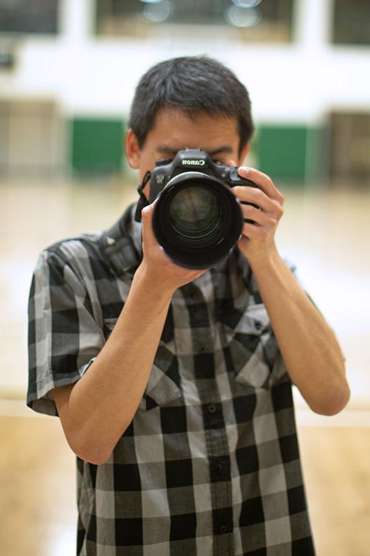 Troy Makalena holding a camera